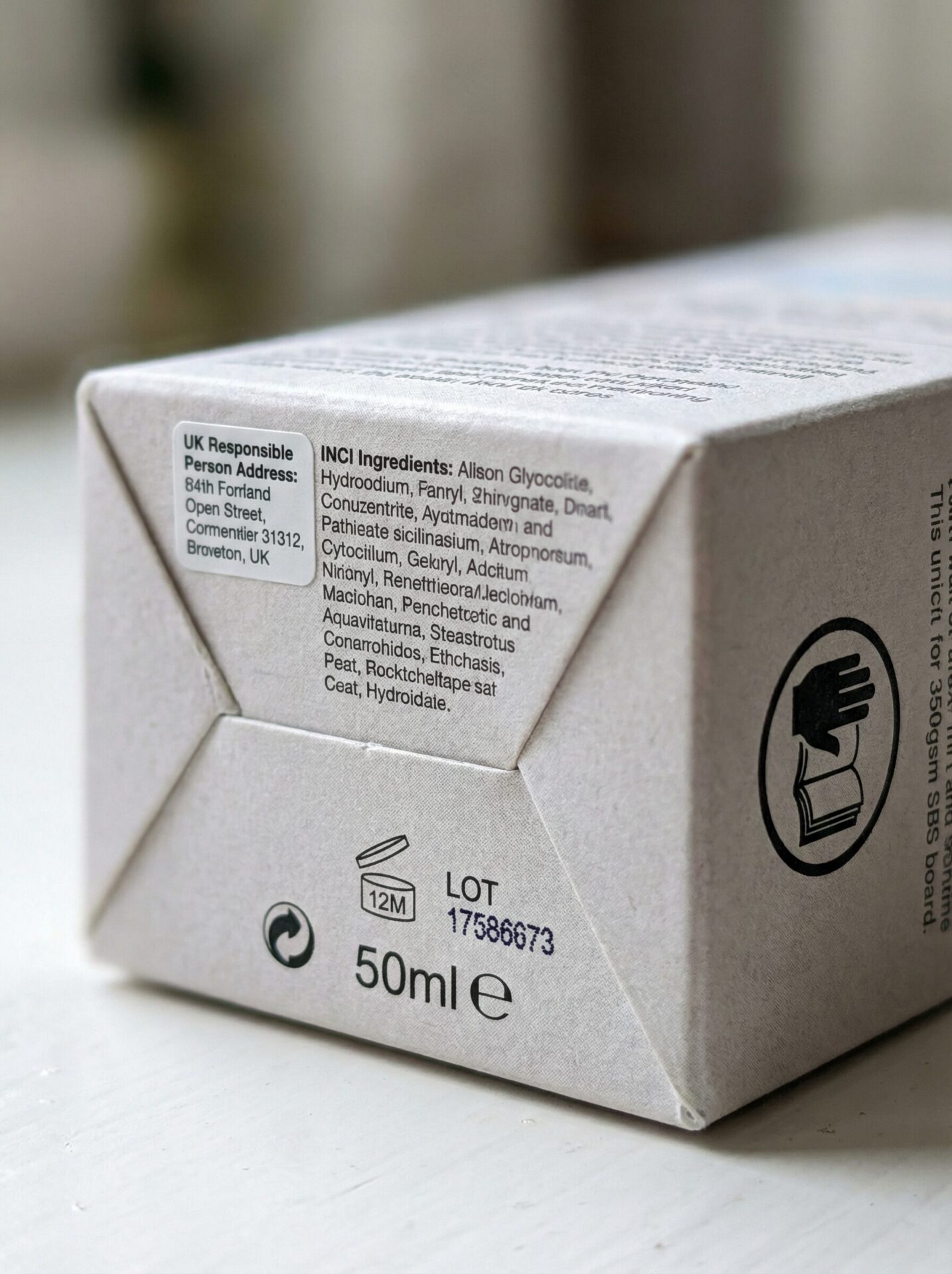 Cosmetic box UK close-up showing UK Responsible Person panel, INCI list, PAO symbol and batch code